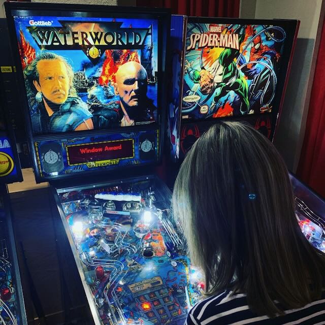 A player leaning into a shot on Waterworld, Spider-Man alongside